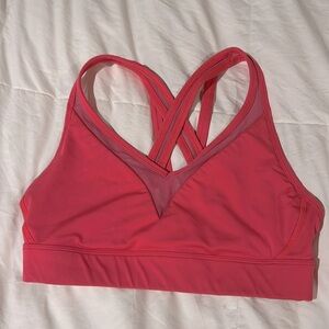 Great condition bright pink Lululemon bra top with mesh accents. Size 6.